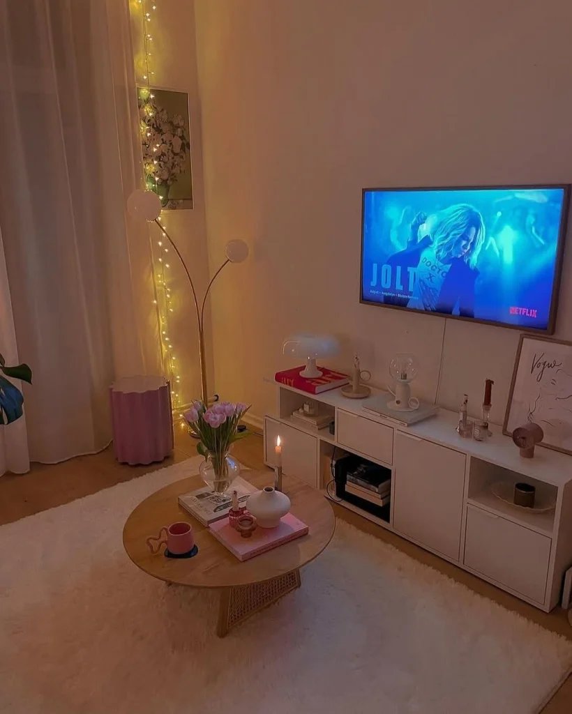 Luxe TV wall with gold metallic accents and deep emerald panels in a modern space.
