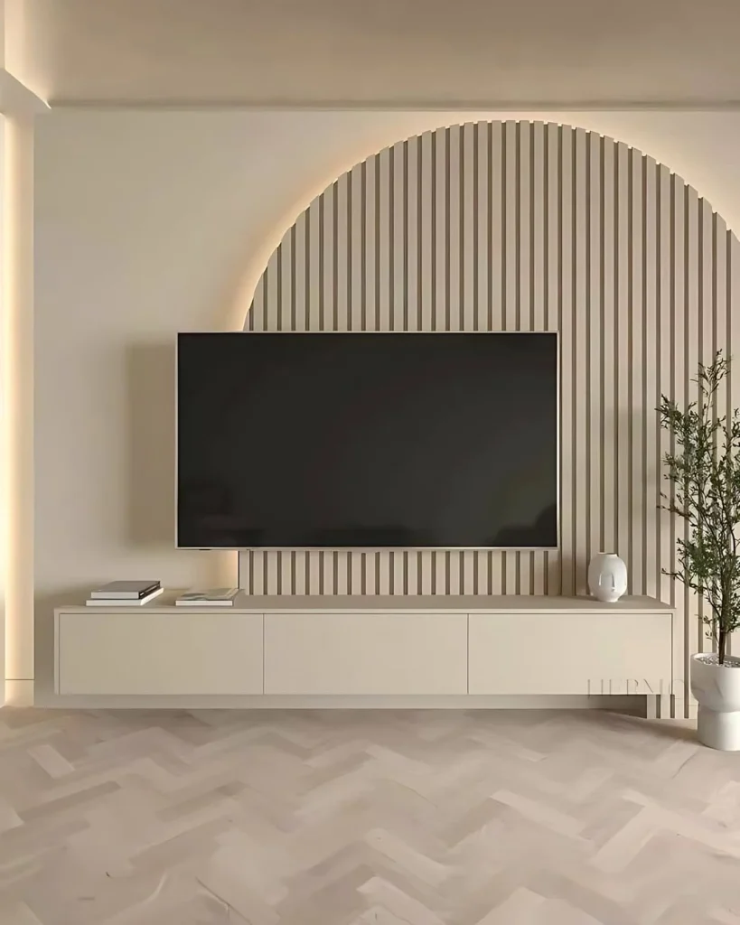 Nature-inspired TV wall design with green accents and wooden shelves for a serene vibe.