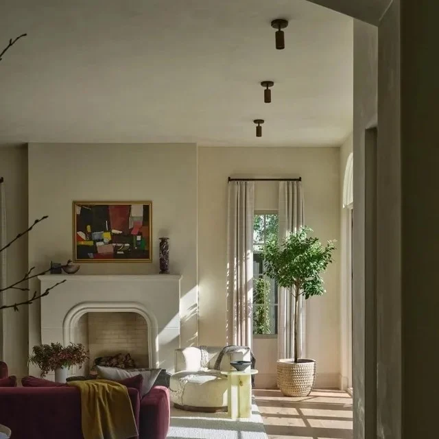 Glamorous gold floor lamp in a chic living room corner.